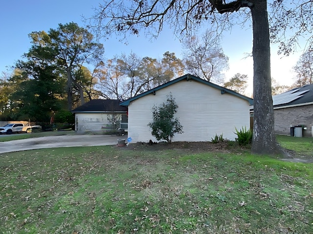 view of home's exterior with a lawn