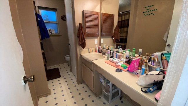 bathroom with vanity and toilet