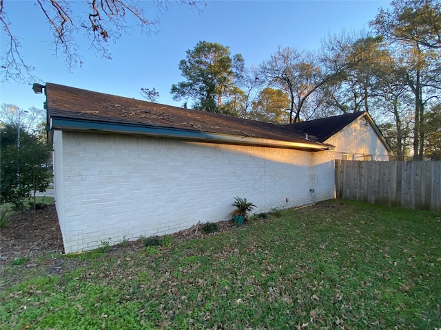 view of home's exterior featuring a yard