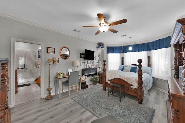 bedroom with light wood-type flooring, ensuite bath, ceiling fan, and crown molding