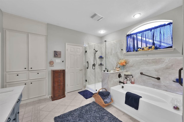 bathroom featuring separate shower and tub, tile patterned flooring, and vanity