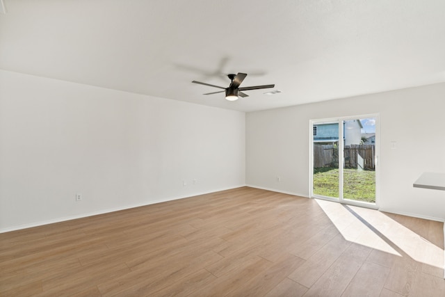 unfurnished room with ceiling fan and light hardwood / wood-style flooring