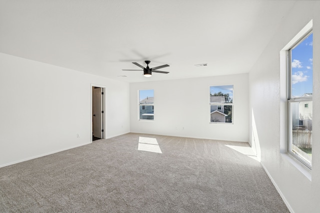 carpeted empty room with ceiling fan