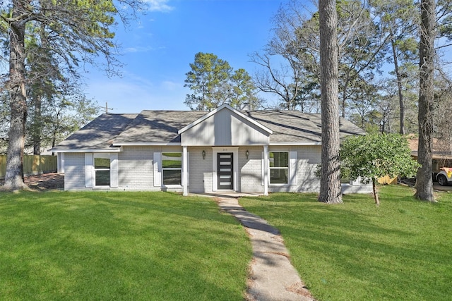 ranch-style home with a front lawn