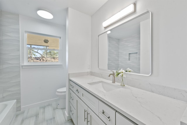 bathroom with toilet and vanity