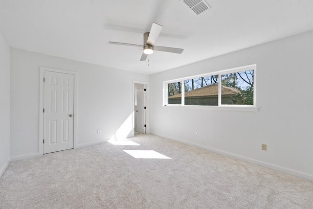 carpeted empty room with ceiling fan