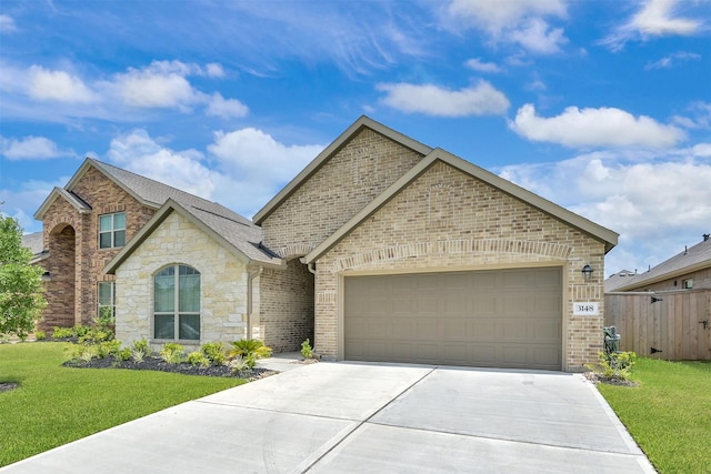 view of front of house with a front lawn and a garage