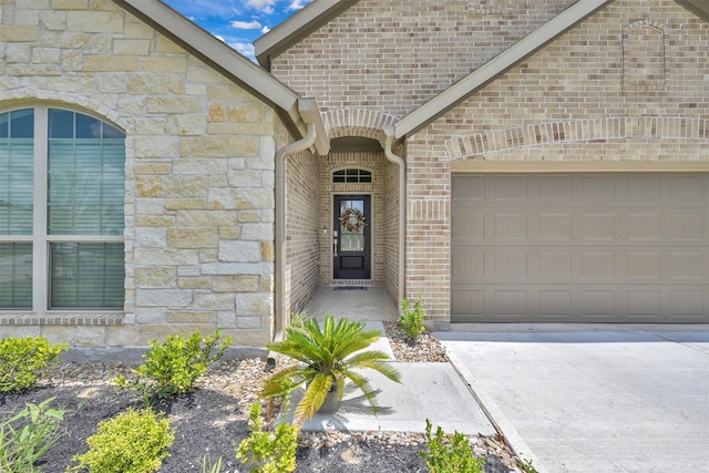 view of exterior entry featuring a garage