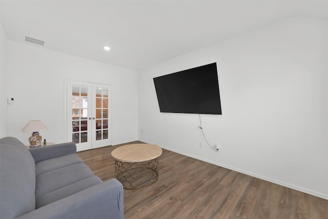 living room featuring wood-type flooring and french doors