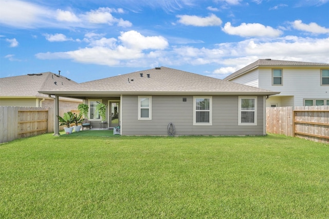 back of property featuring a patio area and a yard