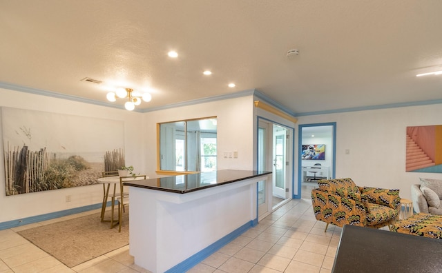 kitchen featuring light tile patterned flooring and ornamental molding