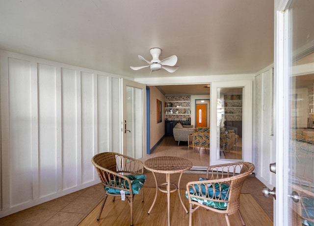 sunroom / solarium with ceiling fan