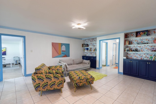 living room with light tile patterned floors and ornamental molding