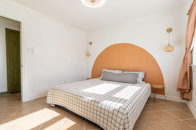 bedroom featuring light tile patterned flooring and crown molding