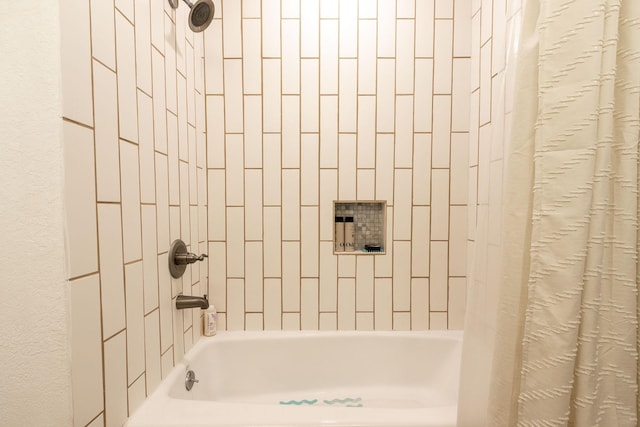 bathroom with shower / tub combo with curtain