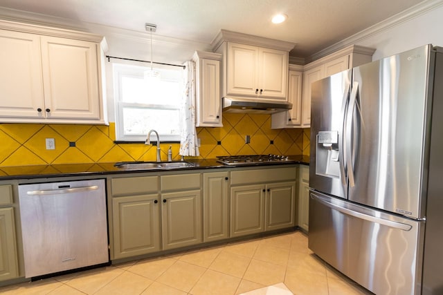 kitchen featuring sink, stainless steel appliances, crown molding, decorative light fixtures, and light tile patterned flooring