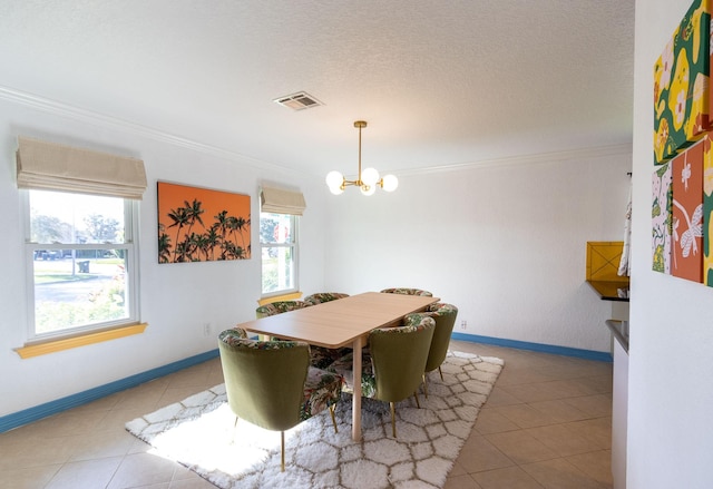 dining room featuring ornamental molding, a wealth of natural light, and a chandelier