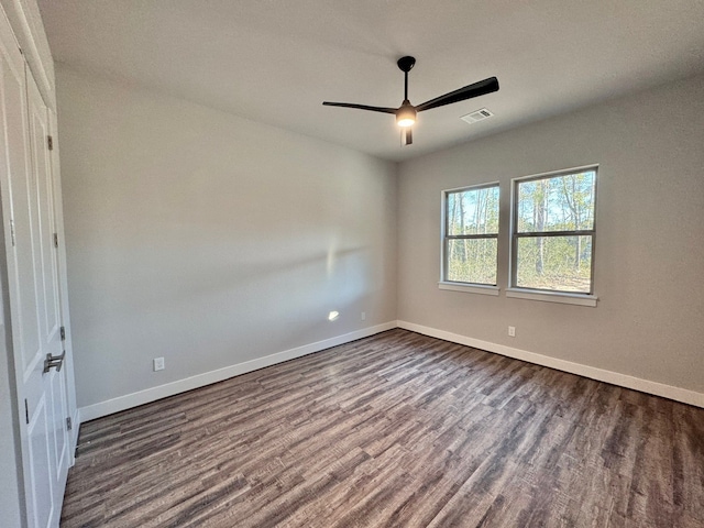 unfurnished room featuring hardwood / wood-style floors and ceiling fan