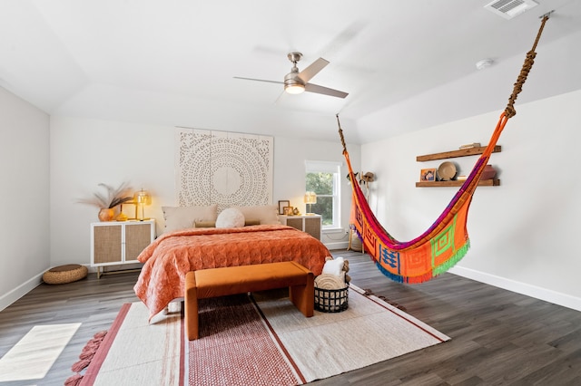 bedroom featuring wood-type flooring, vaulted ceiling, and ceiling fan