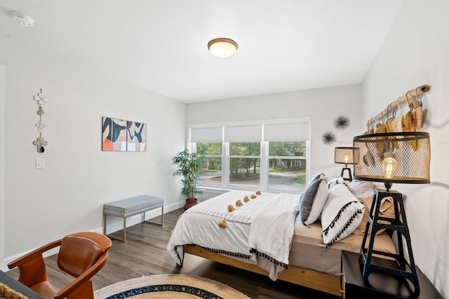 bedroom with hardwood / wood-style flooring