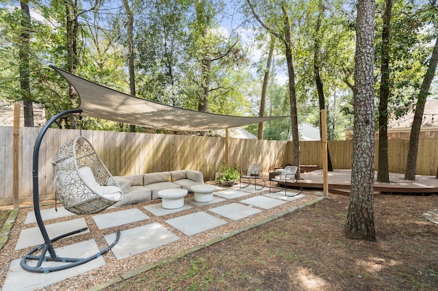 view of patio featuring an outdoor hangout area and a deck