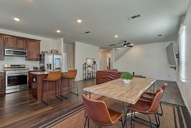 dining space with dark wood-type flooring, recessed lighting, and visible vents