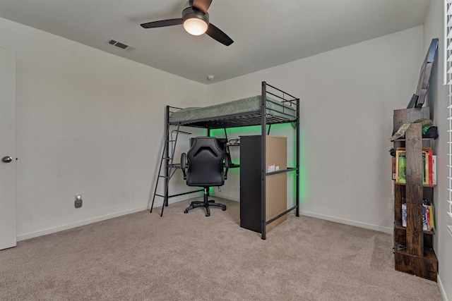 carpeted bedroom with ceiling fan