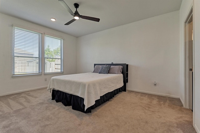 bedroom featuring recessed lighting, ceiling fan, baseboards, and light colored carpet