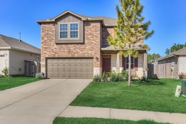 view of front of home with a garage and a front lawn