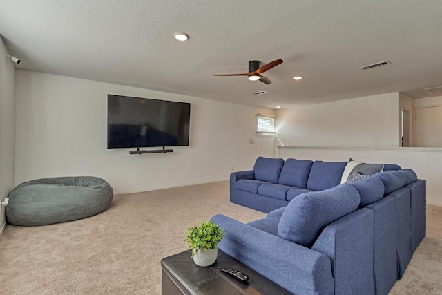 carpeted living room featuring a textured ceiling