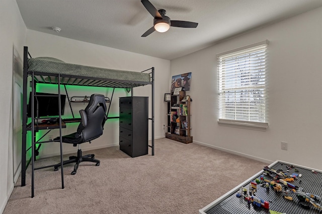 bedroom featuring light carpet and ceiling fan