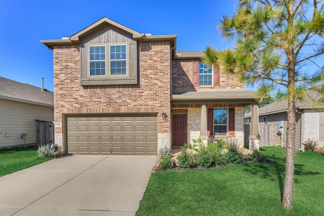 view of front of property featuring a garage and a front lawn