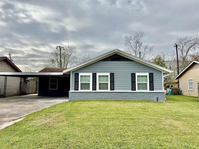 single story home featuring a carport and a front yard