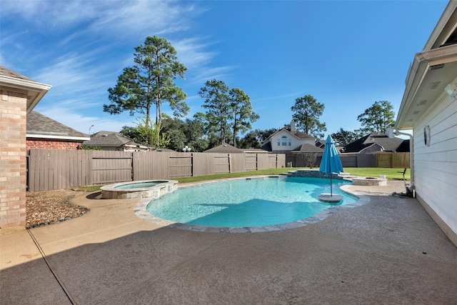 view of swimming pool with an in ground hot tub and a patio area