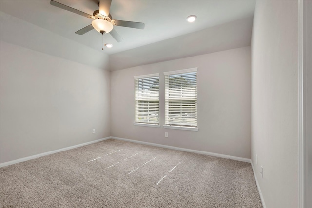 carpeted empty room with lofted ceiling and ceiling fan