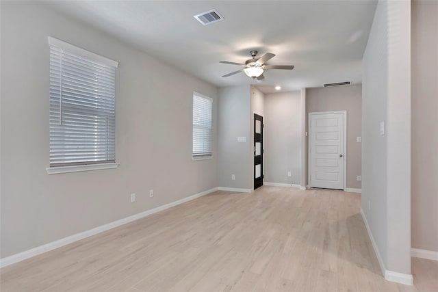 unfurnished room with light hardwood / wood-style floors and ceiling fan