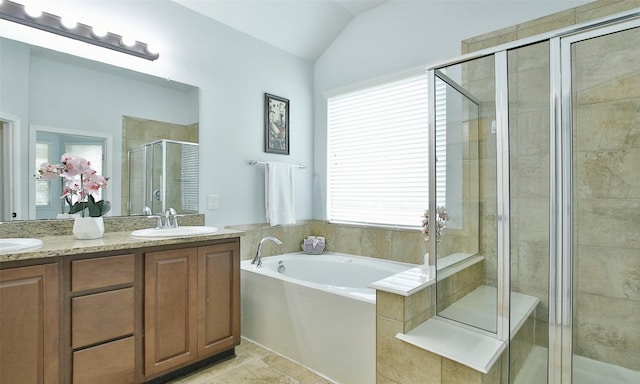 bathroom featuring a healthy amount of sunlight, lofted ceiling, and shower with separate bathtub