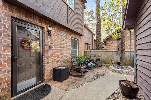 entrance to property featuring a patio