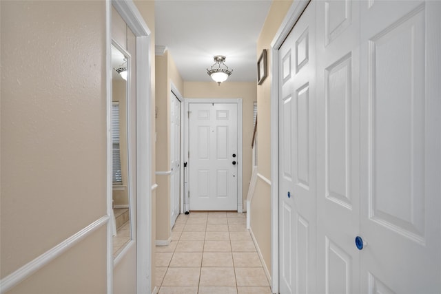 doorway featuring light tile patterned floors