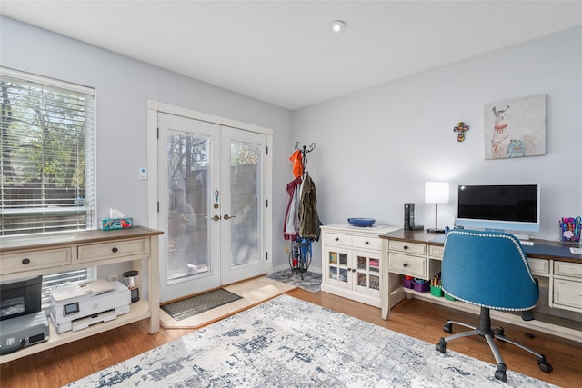 office space with french doors and hardwood / wood-style flooring