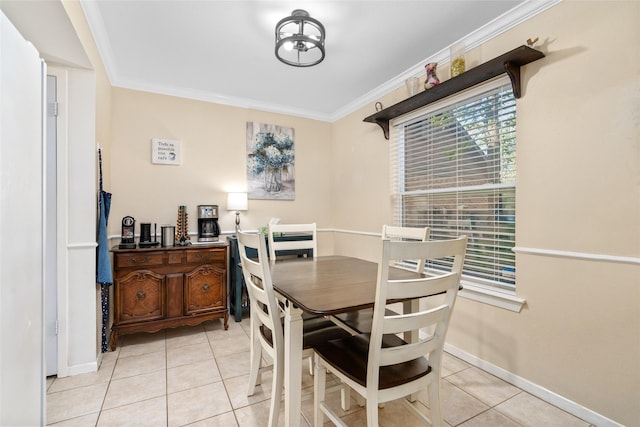 dining room with light tile patterned floors and ornamental molding