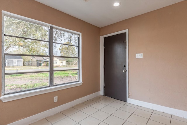 empty room with light tile patterned flooring