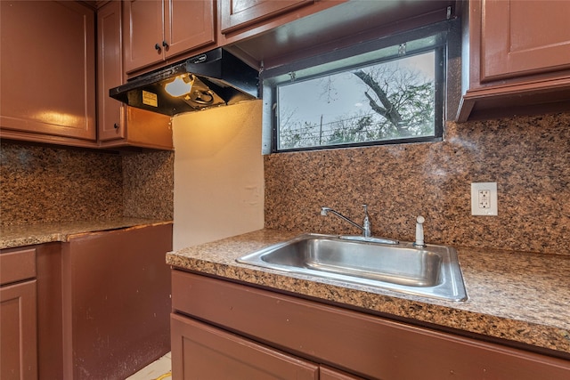 kitchen with decorative backsplash and sink