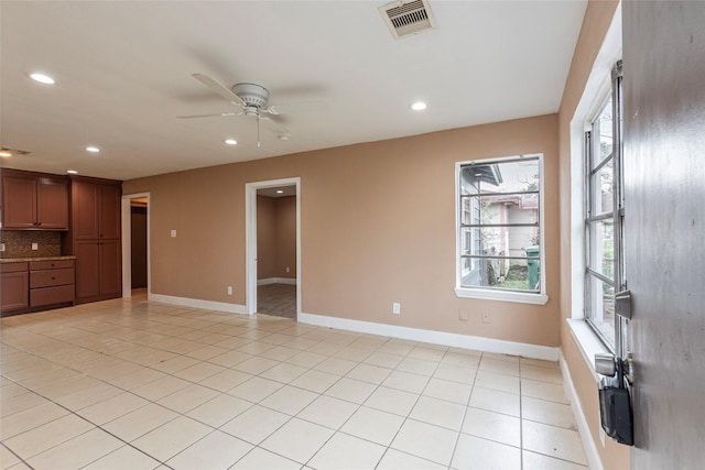 interior space featuring ceiling fan and light tile patterned flooring