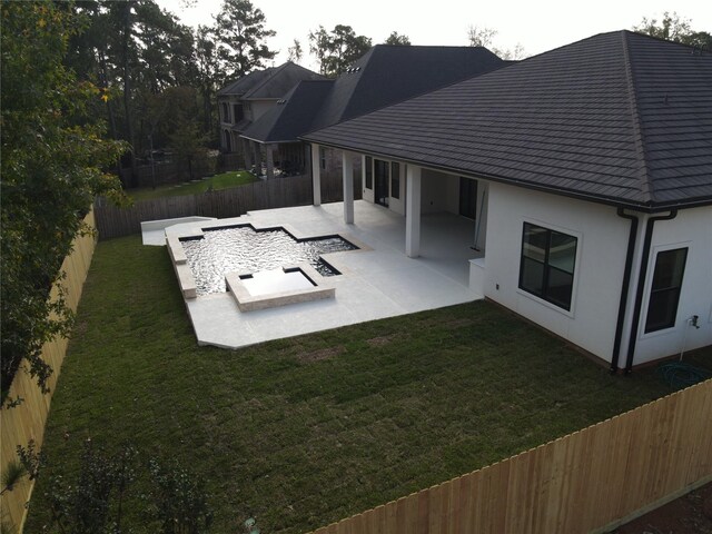 view of pool with a patio area and a yard