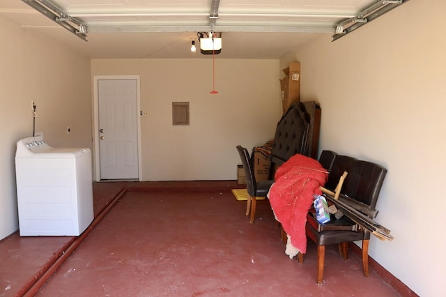 garage with electric panel, a garage door opener, and washing machine and dryer