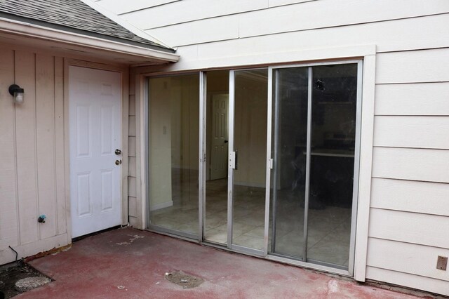 doorway to property featuring a patio area