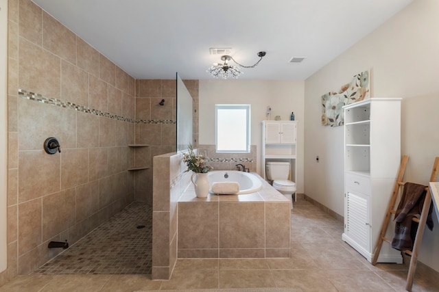 bathroom featuring tile patterned flooring, plus walk in shower, and toilet