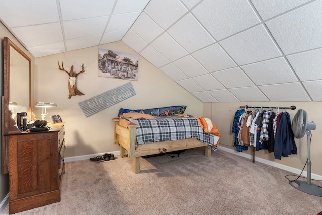 bedroom featuring a paneled ceiling, vaulted ceiling, and carpet