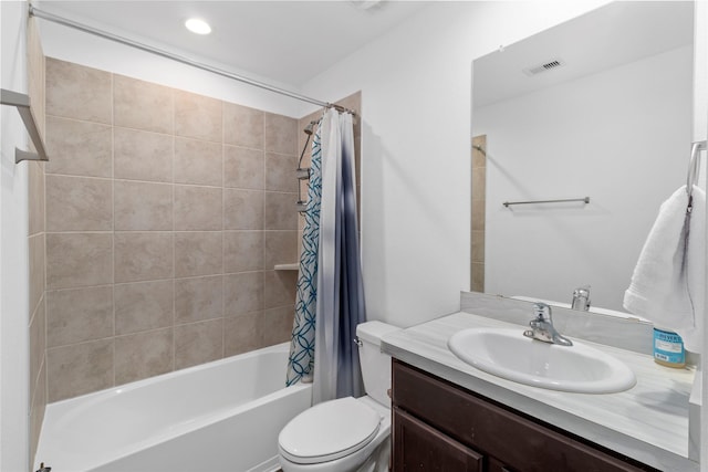 full bathroom featuring shower / tub combo, vanity, and toilet